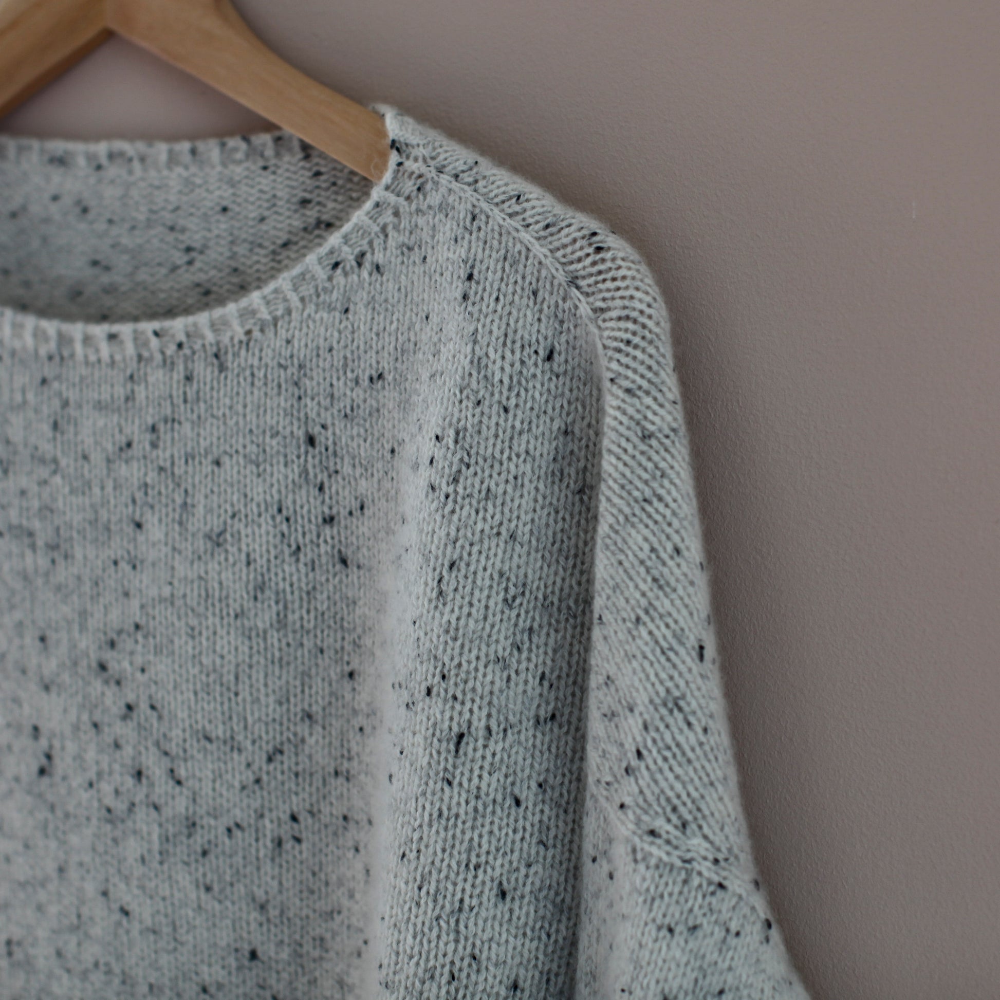 A close up of the shoulder detail of the Summer Soft jersey. It shows the very neat faux seam created when working top down