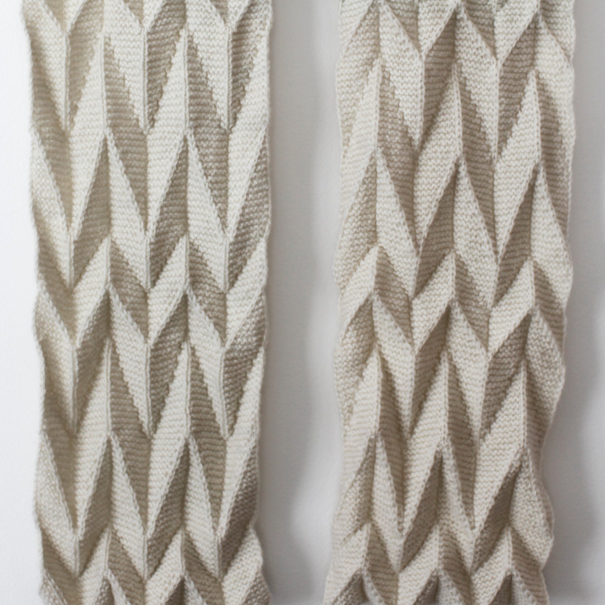 a close up view of the Ups and Downs scarf on a white background